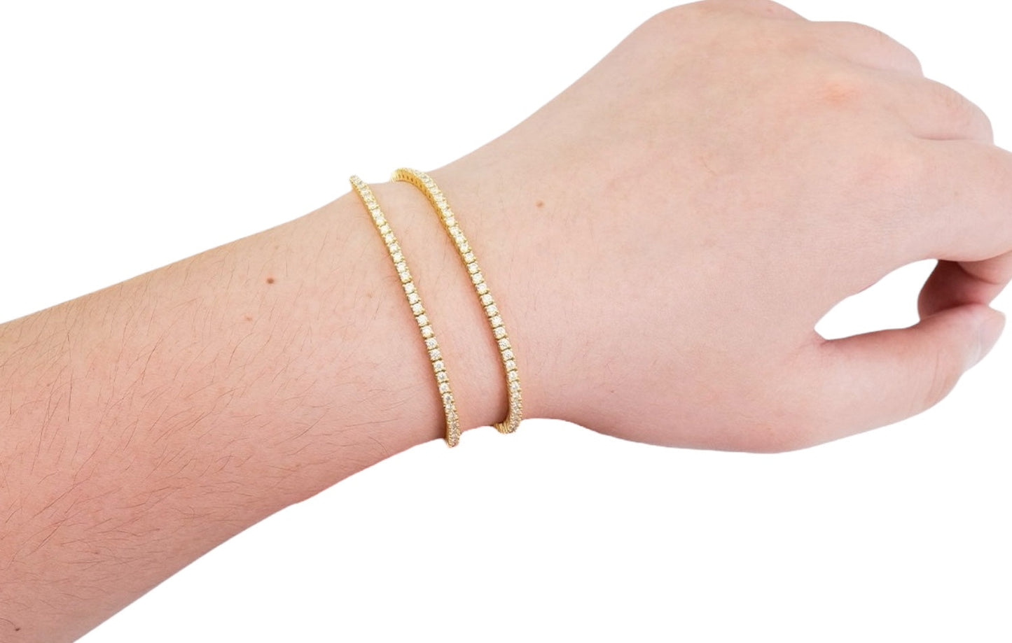 Luxe 18K gold plated moissanite tennis bracelet with 2mm round stones set in 925 sterling silver, displayed on model wrist